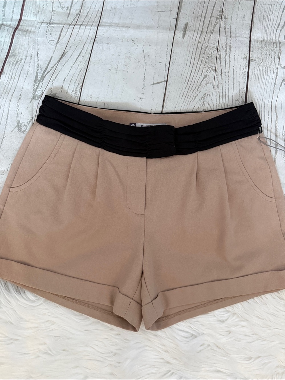 Jennifer Lopez Beige High-Waist Shorts with Black Pleated Waistband